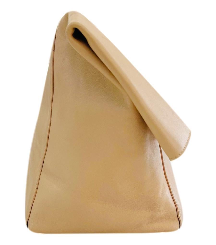 Celine Leather Fold-Over Clutch Bag
Beige clutch bag designed with fold-over front with silver 'Celine' engraved plaque.
Featuring hidden zipped pocket and spacious suede interior with slip pockets.
Size – Height 21cm, Width 37cm, Depth