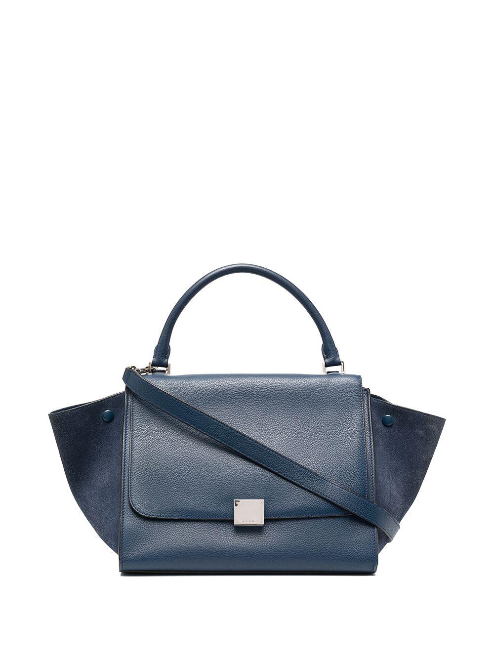 Celine blue leather & suede Trapeze Medium size tote bag featuring a single rounded top handle, a foldover top,  an adjustable detachable shoulder strap, an internal patch pocket, a rear zip-fastening pocket and silver-tone hardware.
In excellent