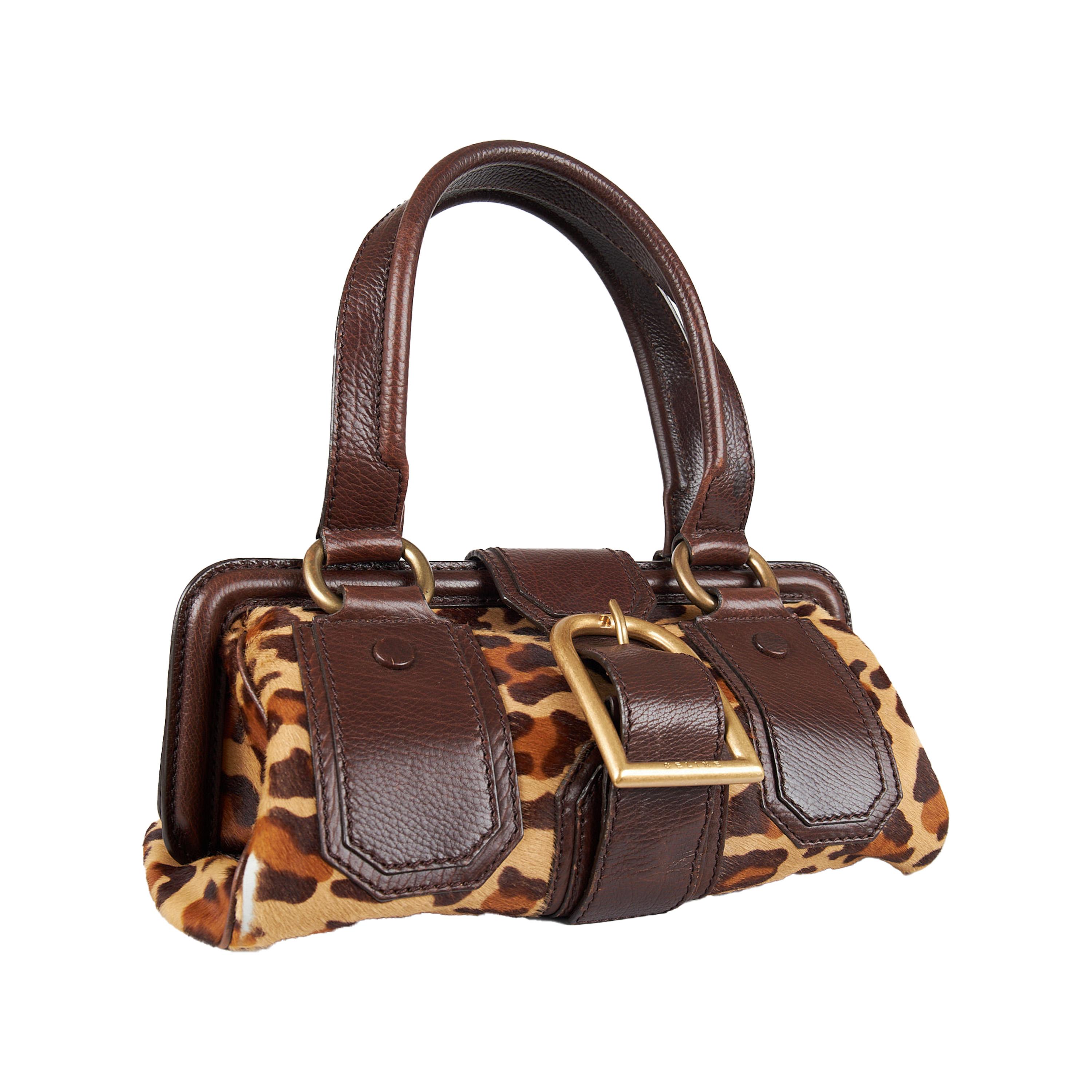 This Celine satchel is an ideal mix of classic and modern, designed by Michael Kors in 2004. Crafted with leopard-printed calf hair and leather, it is lined with dark brown jacquard fabric and boasts a spacious interior for your belongings. Accented