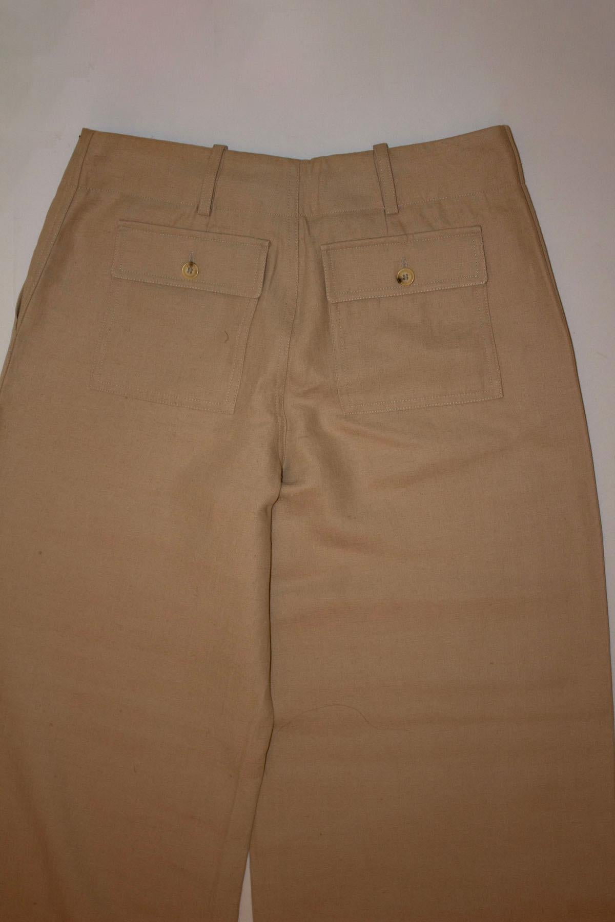 A chic pair of Celine linen pants or trousers.  In a heavy linen fabric they hang beautifully. The trousers have belt hoops,  and 2 back pockets and a very wide leg.  Size 40
Measurements: waist 30'' , inside leg 34'' , hem 2''