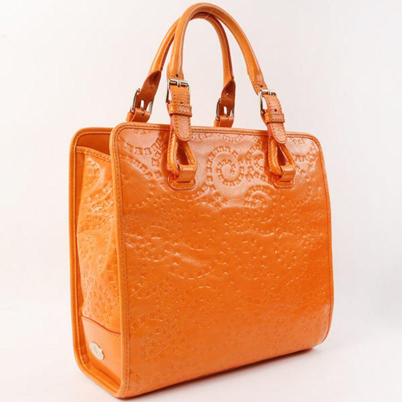 Celine Logo Embossed Top Handle Bag Orange

Additional information:
Interior pocket x3
Accessories: Dust bag.
Size: 28 W x 11 D x 26 H cm
Handle 42-50 cm; 3 Adjustment holes each
Condition: Good
Front: With some rubbing on edge
Back: With some