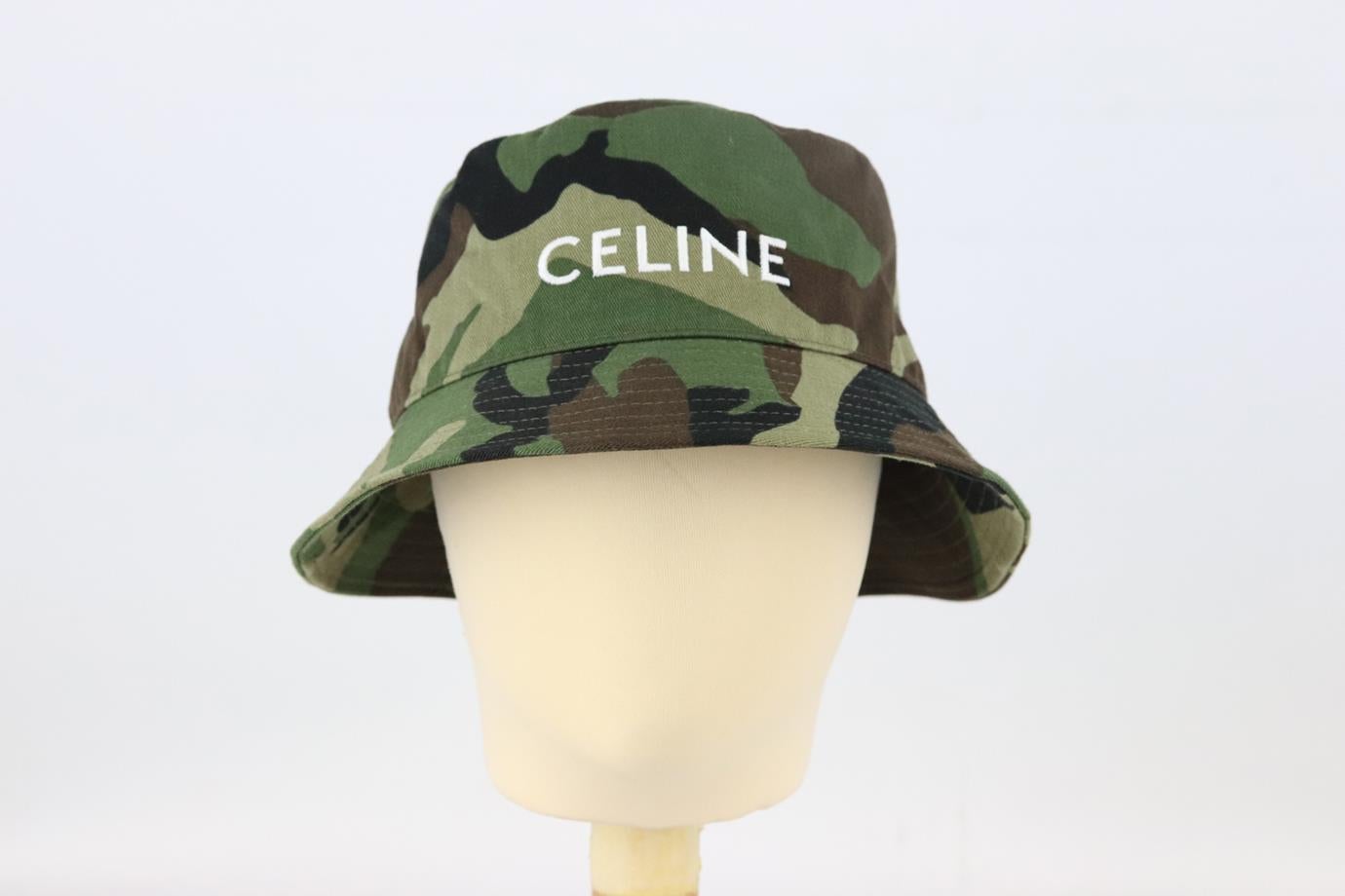 Celine logo embroidered camouflage print cotton twill bucket hat. Green, brown and black. Slips on. 100% Cotton; lining: 65% polyester, 35% cotton. Does not come with dustbag or box. Size: Medium (57 cm). Brim width: 2.2 in Very good condition -