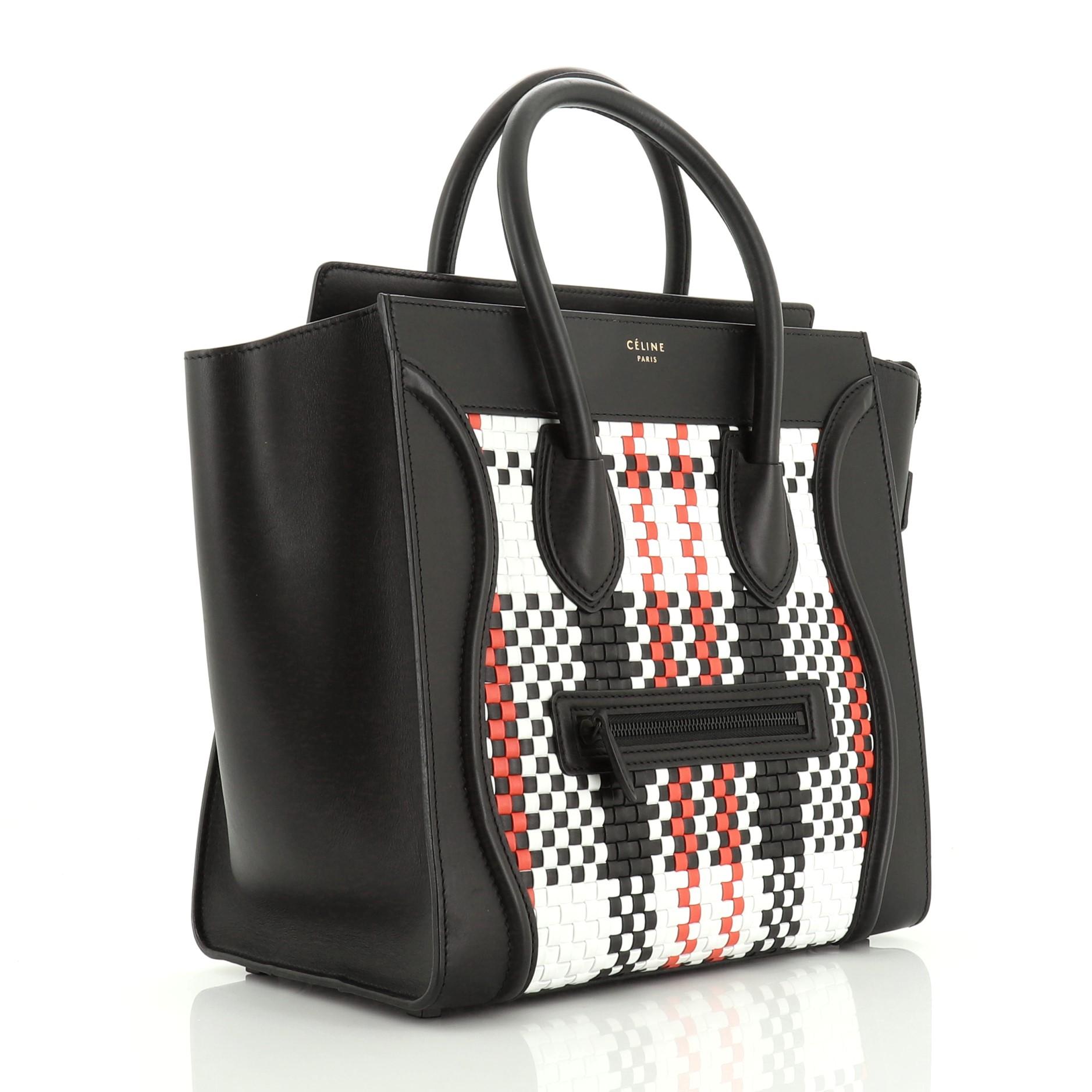 This Celine Luggage Bag Woven Leather Mini, crafted from black, red and white woven leather, features dual rolled handles, exterior front pocket, protective base studs, stamped logo at the center, and black-tone hardware. Its zip closure opens to a