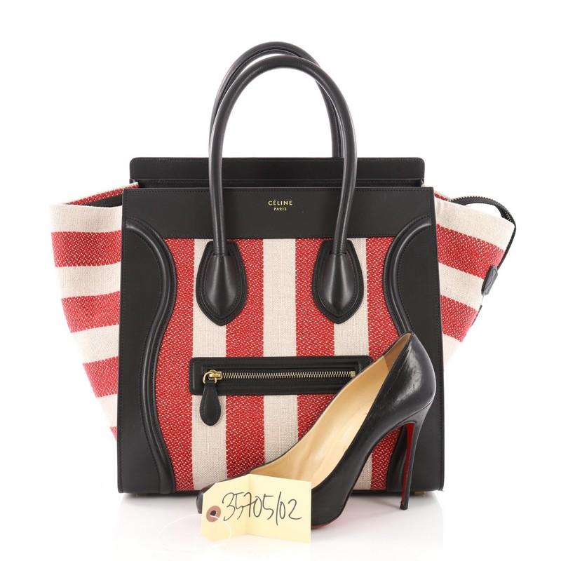 This authentic Celine Luggage Handbag Canvas and Leather Mini is one of the most sought-after bags beloved by fashionistas. Crafted from red and beige canvas and black Leather, this minimalist tote features dual-rolled handles, an exterior front