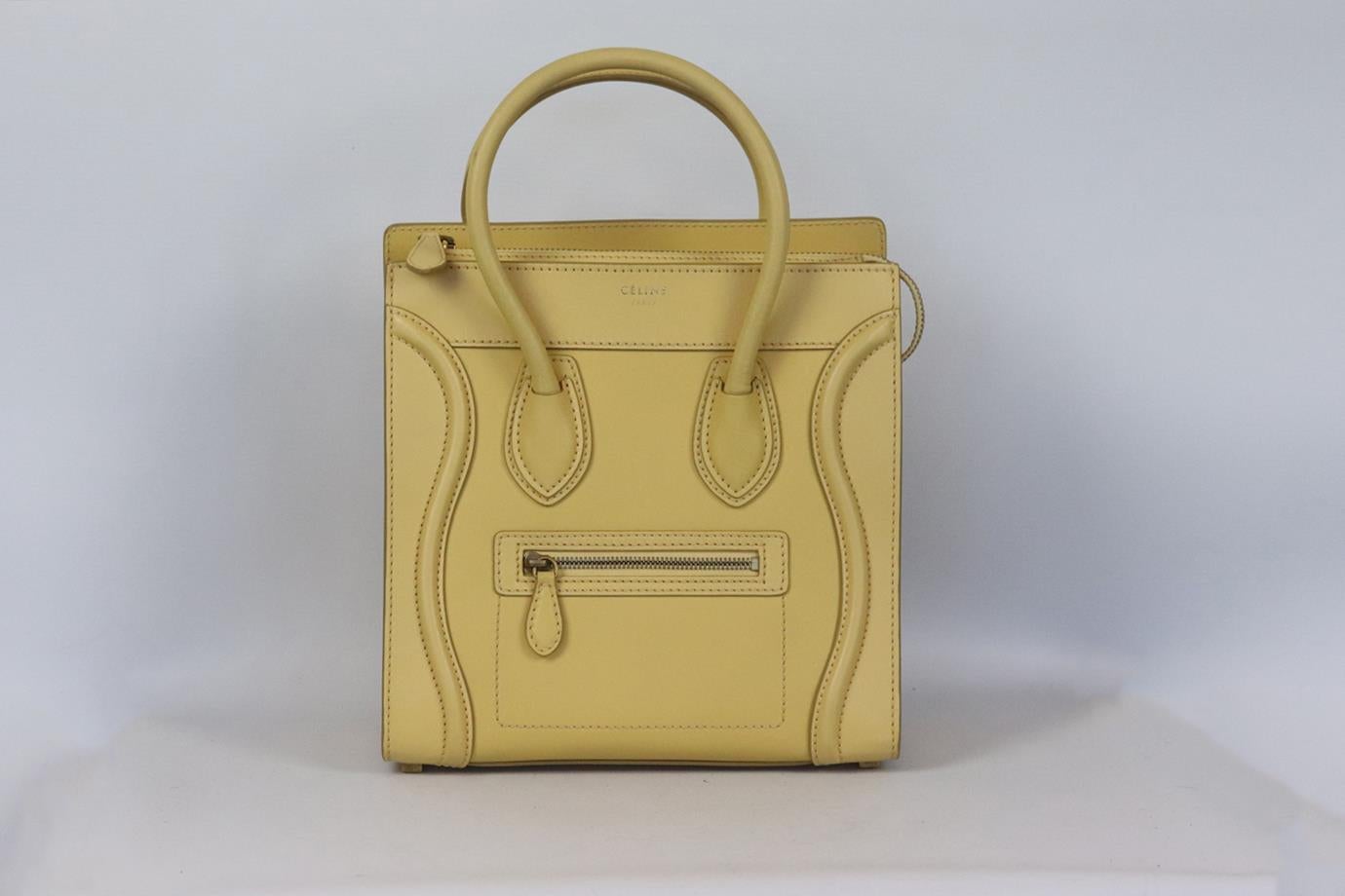 Celine Luggage micro leather tote bag. Yellow and beige. Zip fastening at top. Does not come with dustbag or box. Height: 10.5 in. Width: 10.3 in. Depth: 5.4 in. Handle Drop: 4.5 in. Very good condition - Two light marks to base. Some scratching to
