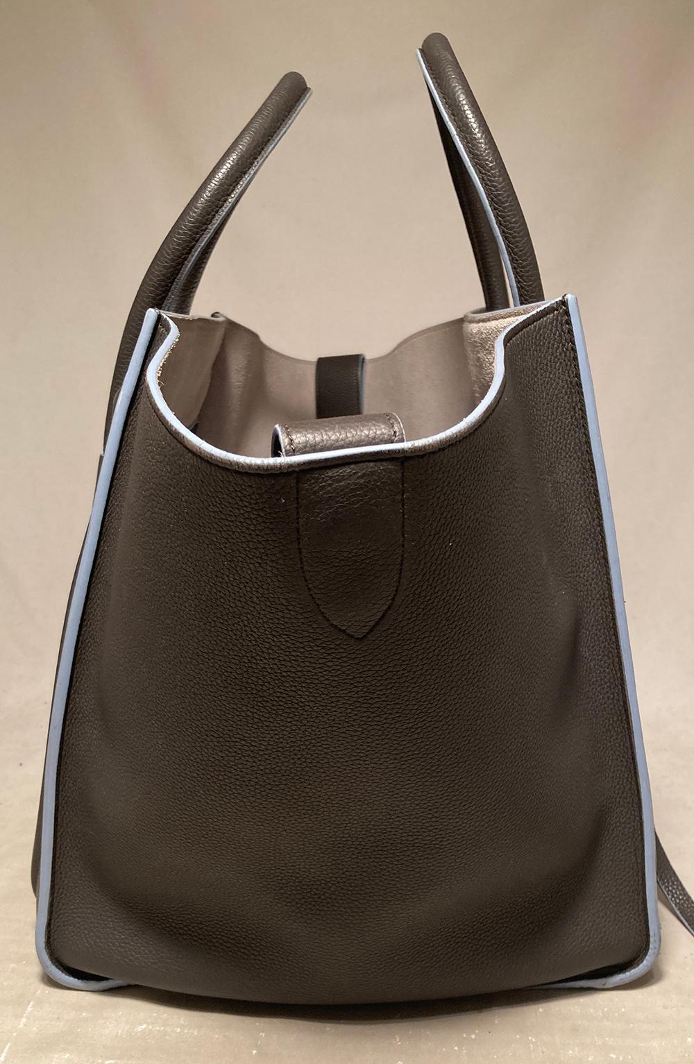 Celine Medium Grey Leather Phantom Luggage Tote in very good condition. Grey grained leather exterior with blue piped edges and front side zippered pocket. Double top rolled handles and expandable side wings that can be pushed out for the classic
