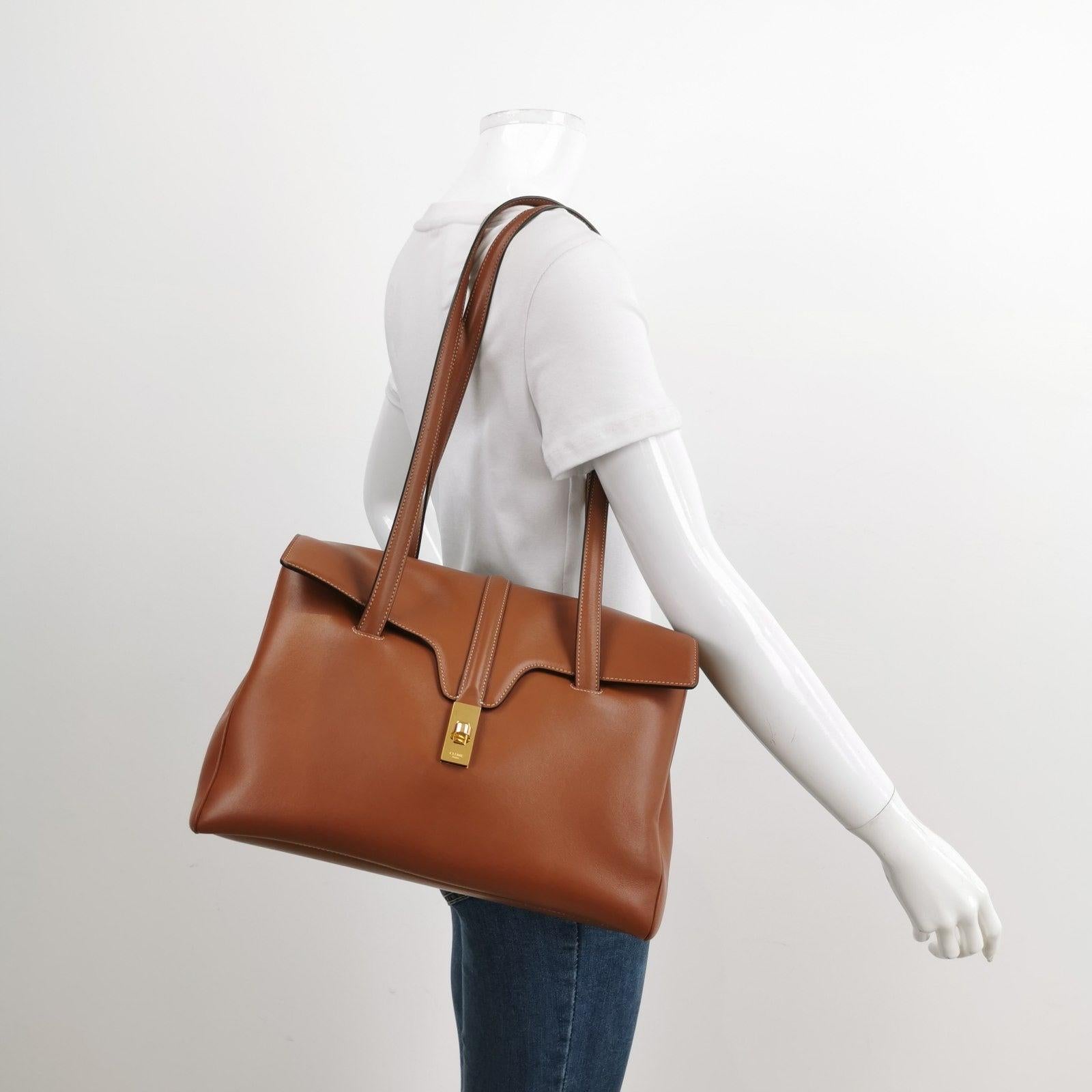 Celine Medoim Soft 16 Bag Caramel Natural Tan Smooth Calfskin Leather
  These are professional photos of the actual bag.
  This Celine 16 Bag is elegantly designed, showcasing a unique blend of classic and modern elements. Dressed in a stunning