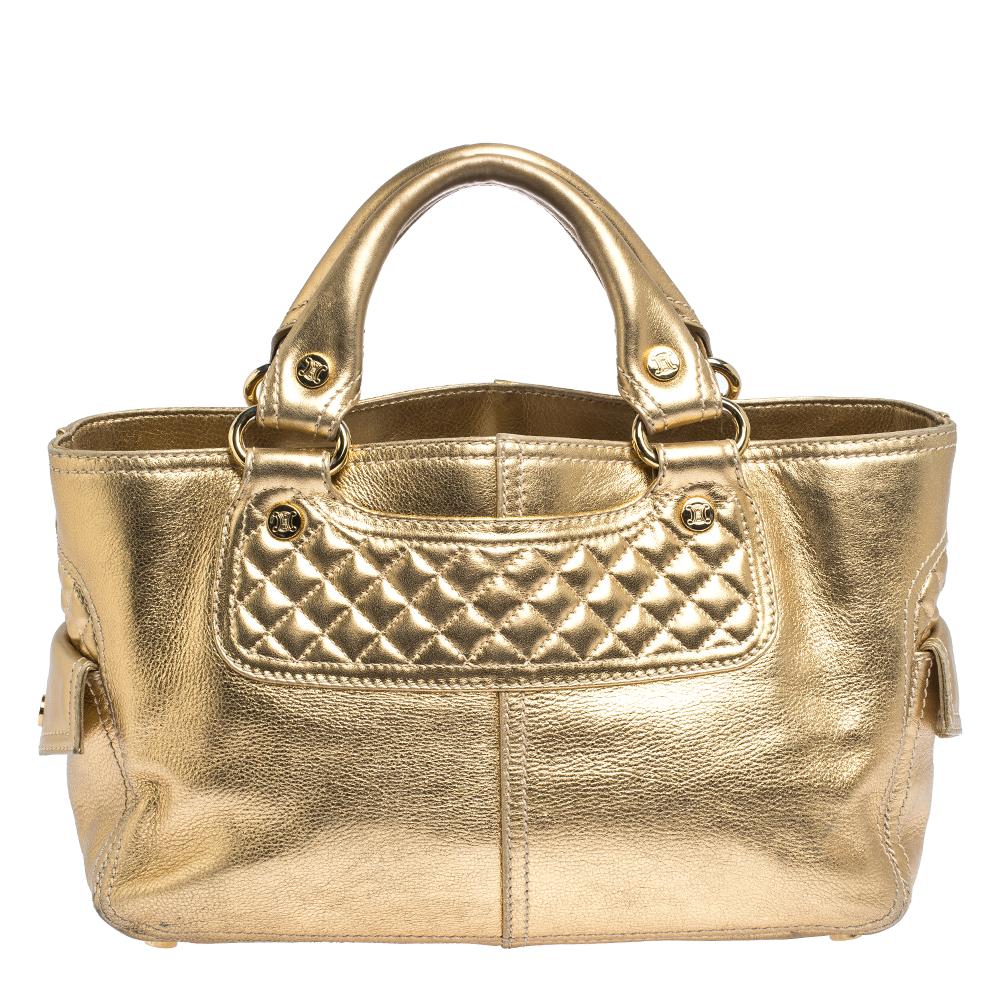 Special days call for special bags, and Celine has just the one for you. This gorgeous Boogie tote is structured to perfection, is covered in a lovely metallic gold hue. It is constructed very carefully using leather. Inside the fabric interior,