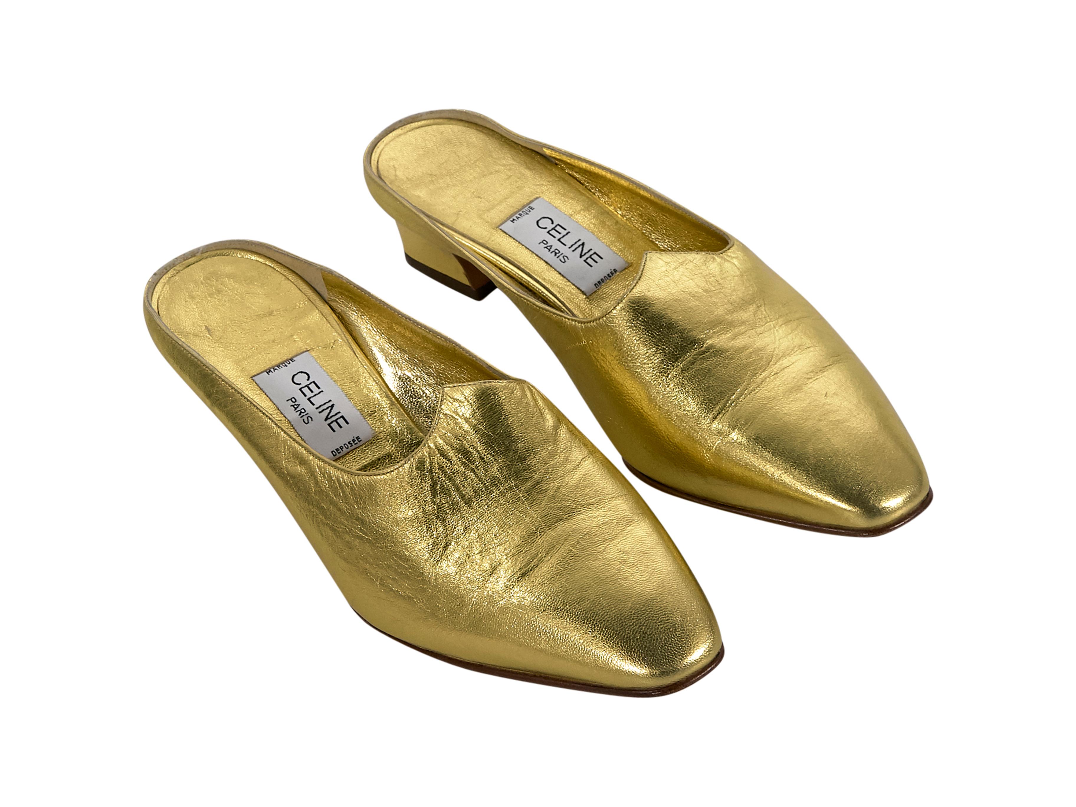 Product details:  Vintage metallic gold leather mules by Celine.  Round toe.  Slip-on style.  1.5