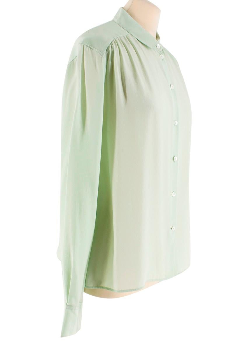 Celine Mint Green Mulberry Silk Shirt

- button up front fastening
- lightweight 
- pleated shoulders detail
- button up cuffs 
- stitched logo embellishment on the front

- 100% Mulberry Silk
- dry clean only
- made in Madagascar 

Please note,