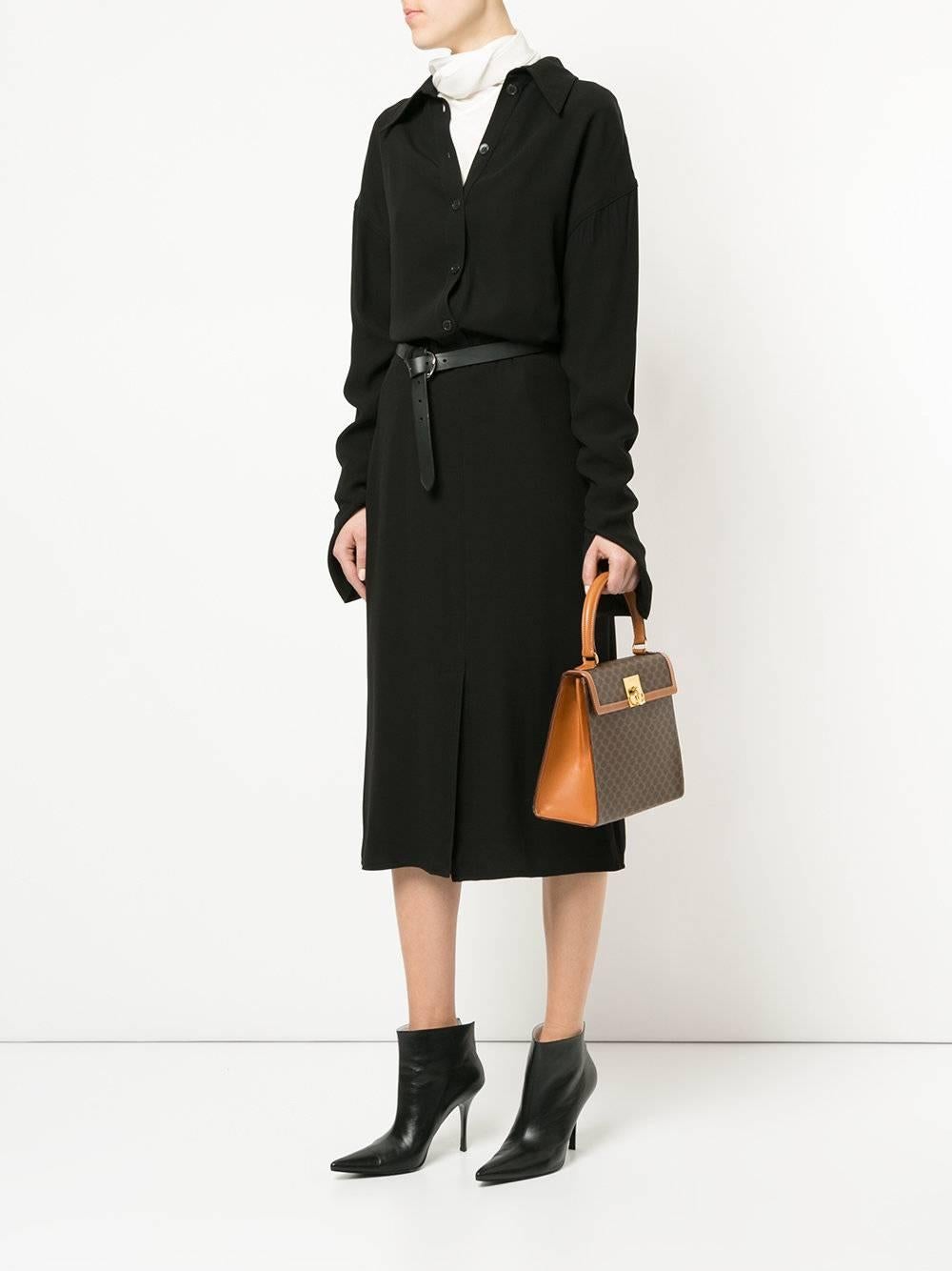 Celine Monogram Cognac Evening Top Handle Satchel Kelly Style Flap Bag

Monogram canvas
Leather trim
Leather lining
Gold tone hardware 
Made in Italy
Handle drop 4