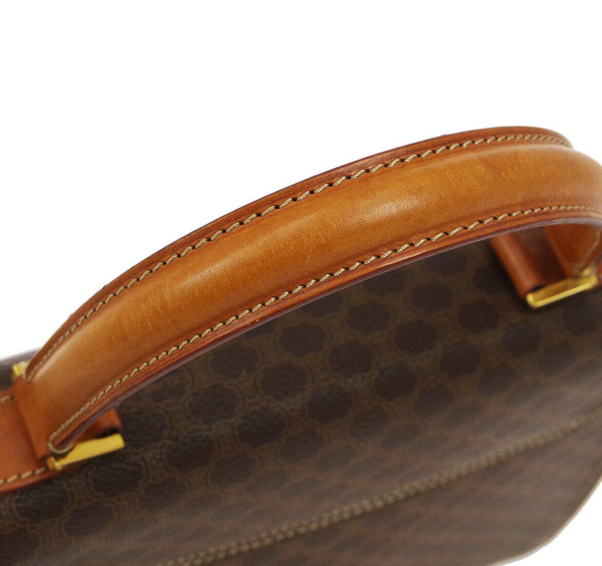 Monogram canvas
Leather
Gold tone hardware
Turnlock closure
Leather lining
Made in Italy
Top handle 4.75
