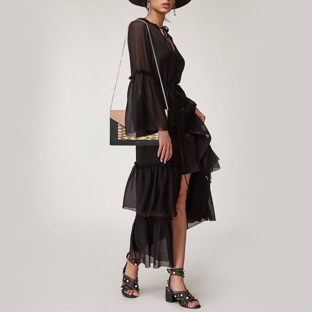 This Pocket Envelope bag from Celine is chic and very stylish. The bag has been crafted in Italy and made from leather. It flaunts lovely multicolored hues that add interest. The shoulder bag features an amazing silhouette that resembles that of an