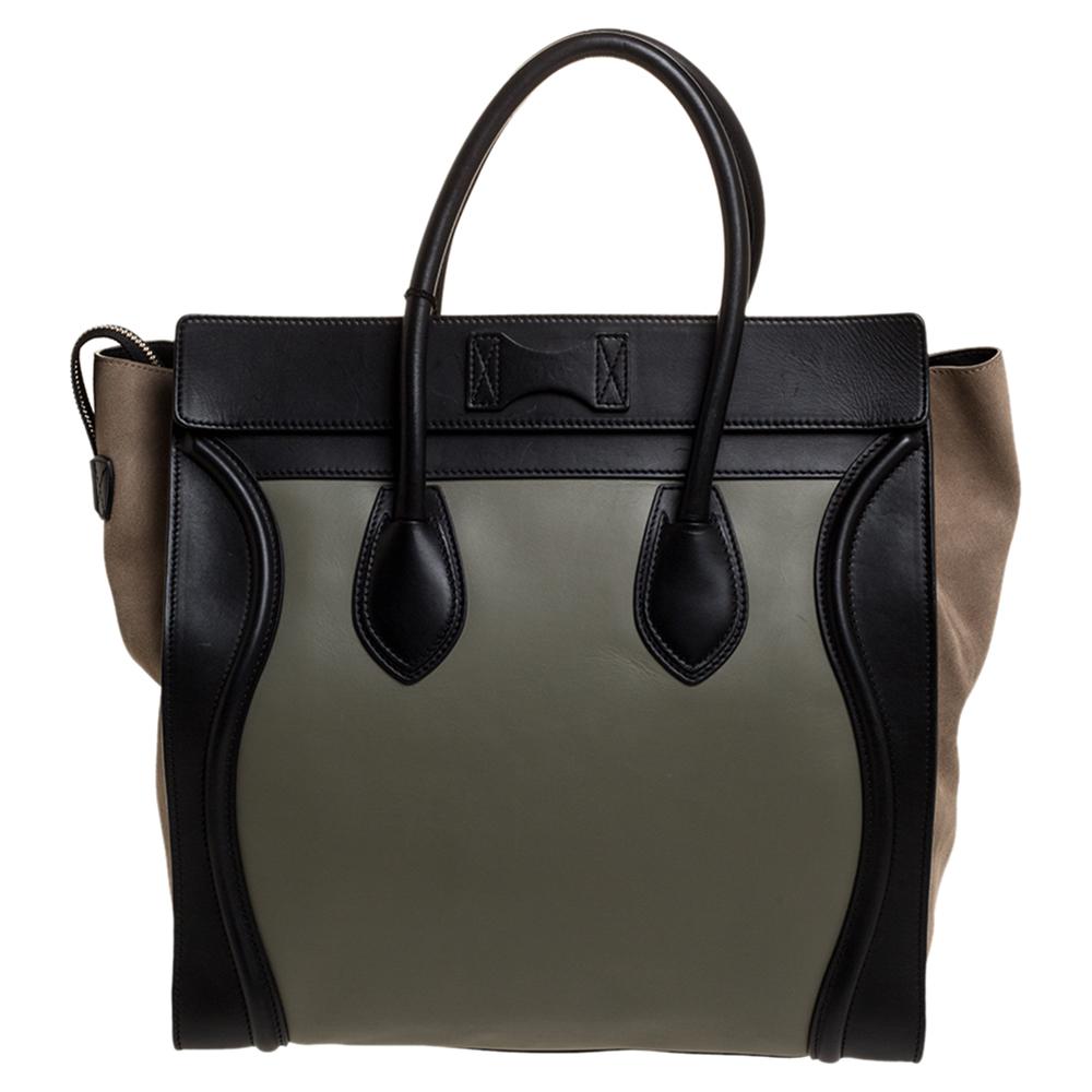 This popular Luggage tote from Celine can now be yours. This tote is crafted from leather and suede. It comes with rolled top handles and a front zip pocket. The bag is equipped with a well-sized leather interior for you to carry your essentials.