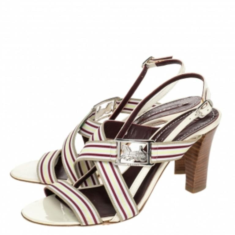 Make an impressive style statement in these gorgeous Celine sandals! The multicolor sandals have been crafted from leather and styled in an open-toe silhouette. They flaunt buckled slingbacks and come equipped with comfortable fabric-lined insoles