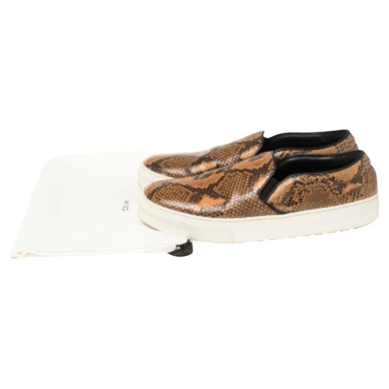 Step out in style wearing these chic Celine sneakers. These multicolor sneakers are crafted from python and leather and feature round toes. They flaunt the brand logo at the back and come endowed with comfortable insoles. They are complete with
