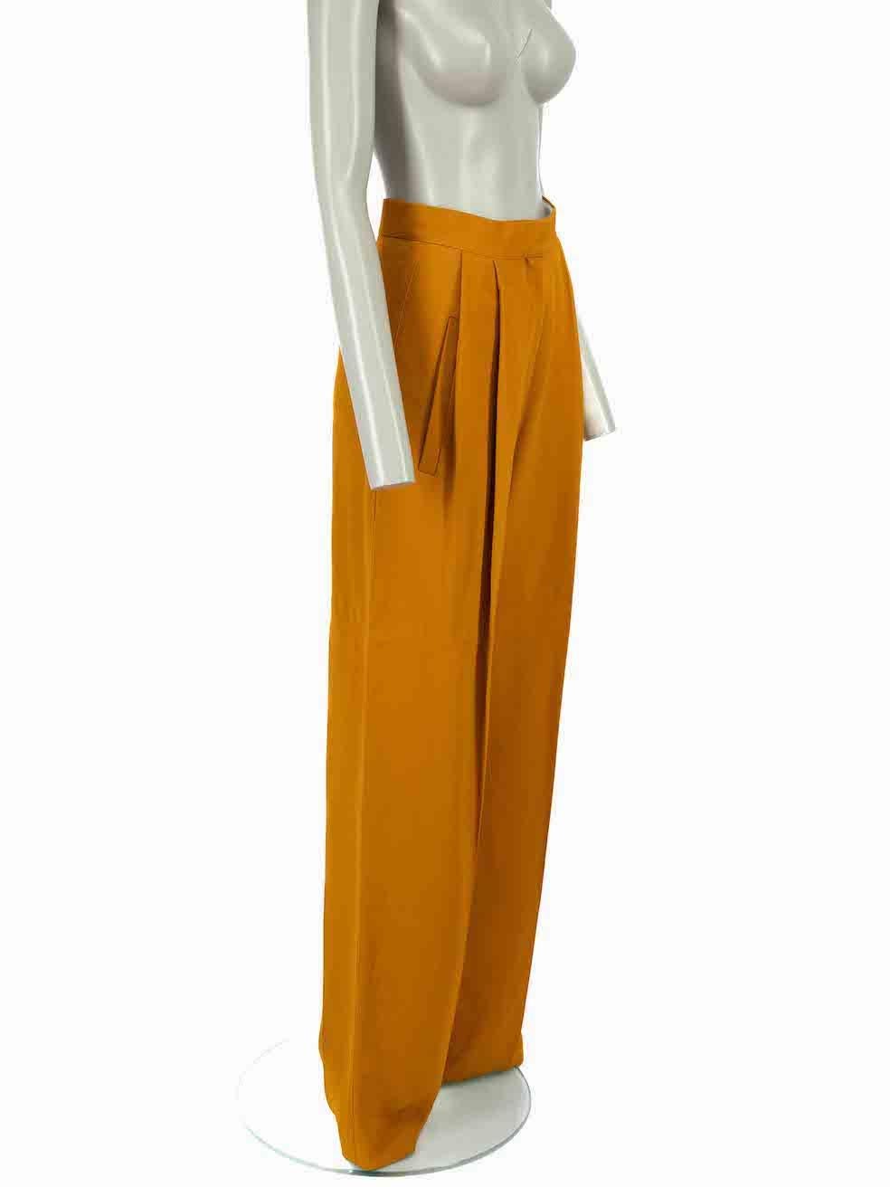 CONDITION is Never worn, with tags. No visible wear to trousers is evident, beyond a single negligible mark at the back leg, on this new Céline designer resale item.
 
 Details
 Mustard yellow
 Viscose
 Wide leg trousers
 High waisted
 Long length
