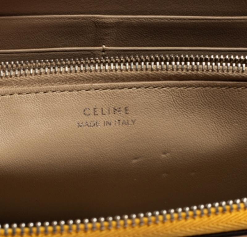 Cartera con cremallera de piel amarilla mostaza Celine en Bueno estado para la venta en Dubai, Al Qouz 2