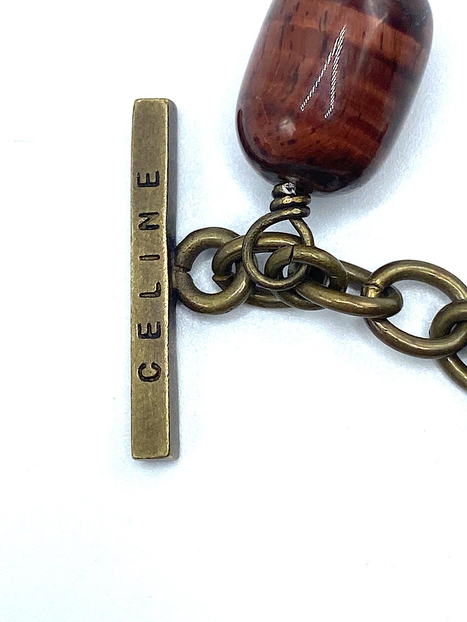 Pulsera con dije de nombre y logotipo de Celine con pátina de bronce antiguo, años 90 en venta 6