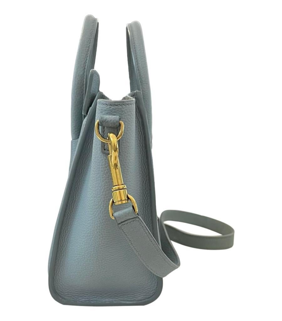 Celine Nano Luggage Leather Bag

Sage grey handbag with detachable shoulder strap.

Detailed with gold hardware, 'Celine' branding and zipped pocket top the front.

Featuring dual rolled top handle and zipped top leading to suede interior. Rrp