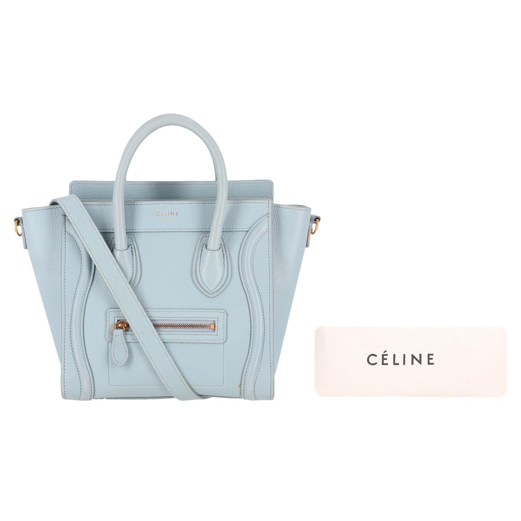 Celine Nano Luggage Leather Bag

Light blue handbag crafted from grained calfskin with gold, branded hardware.

Featuring 'Celine' signature in gold to the front and front zip pocket.

Two rolled leather handles and detachable, adjustable shoulder