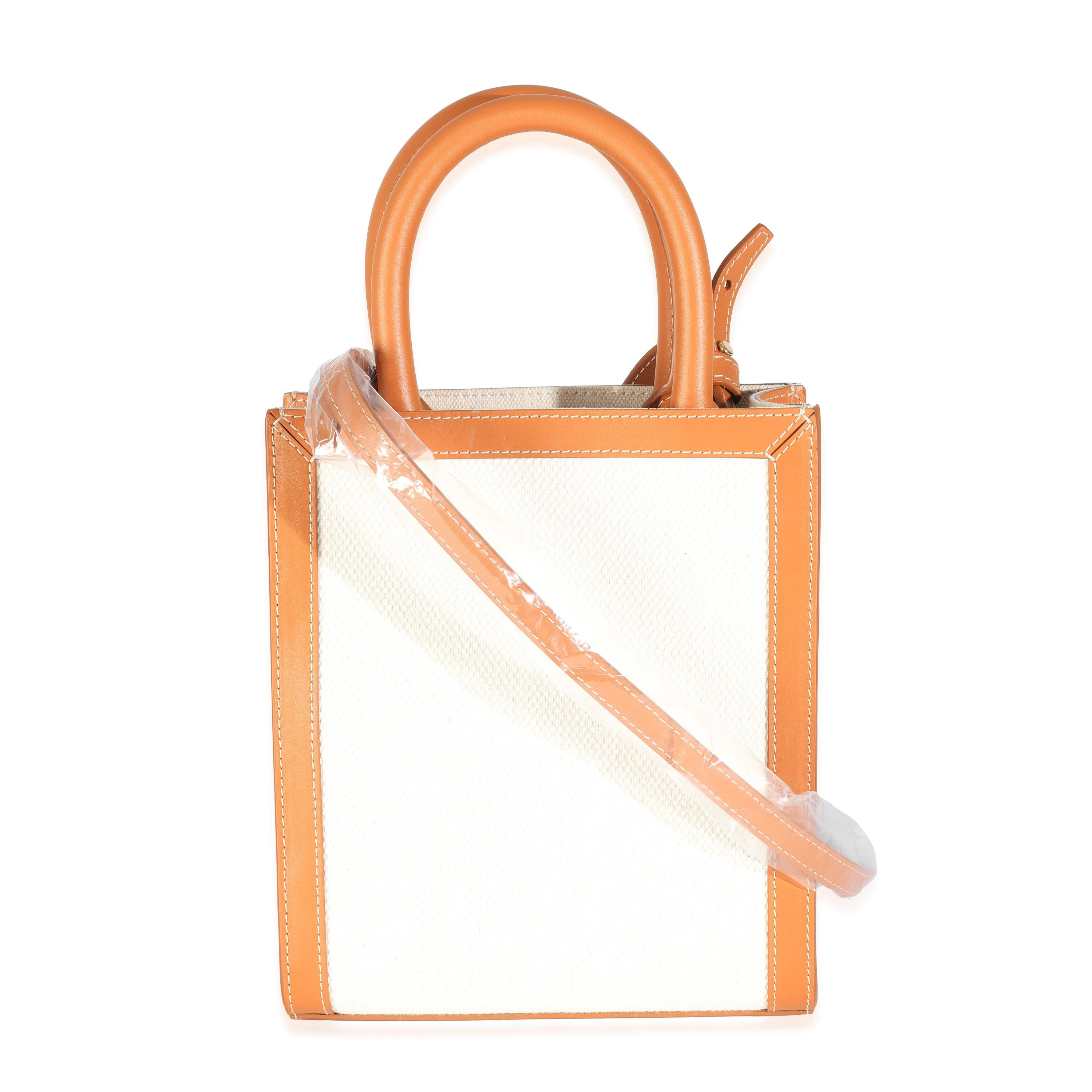 Listing Title: Celine Natural Tan Canvas Calfskin Mini Vertical Cabas Bag
SKU: Z144458
Condition: Pre-owned 
Handbag Condition: Pristine
Condition Comments: Item has no indication of wear.  Final sale.
Brand: Celine
Model: Mini Vertical Cabas
Origin