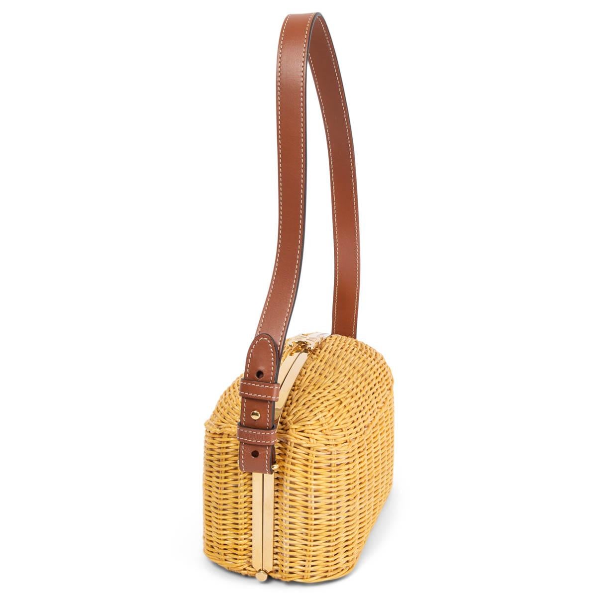 100% authentic Celine 2021 Lunch Box shoulder bag in natural wicker and tan calfskin shoulder-strap. Opens with a gold-tone frame logo clasp and is lined in tn leather with two compartments with one zip pocket in the middle. Brand new. Comes with
