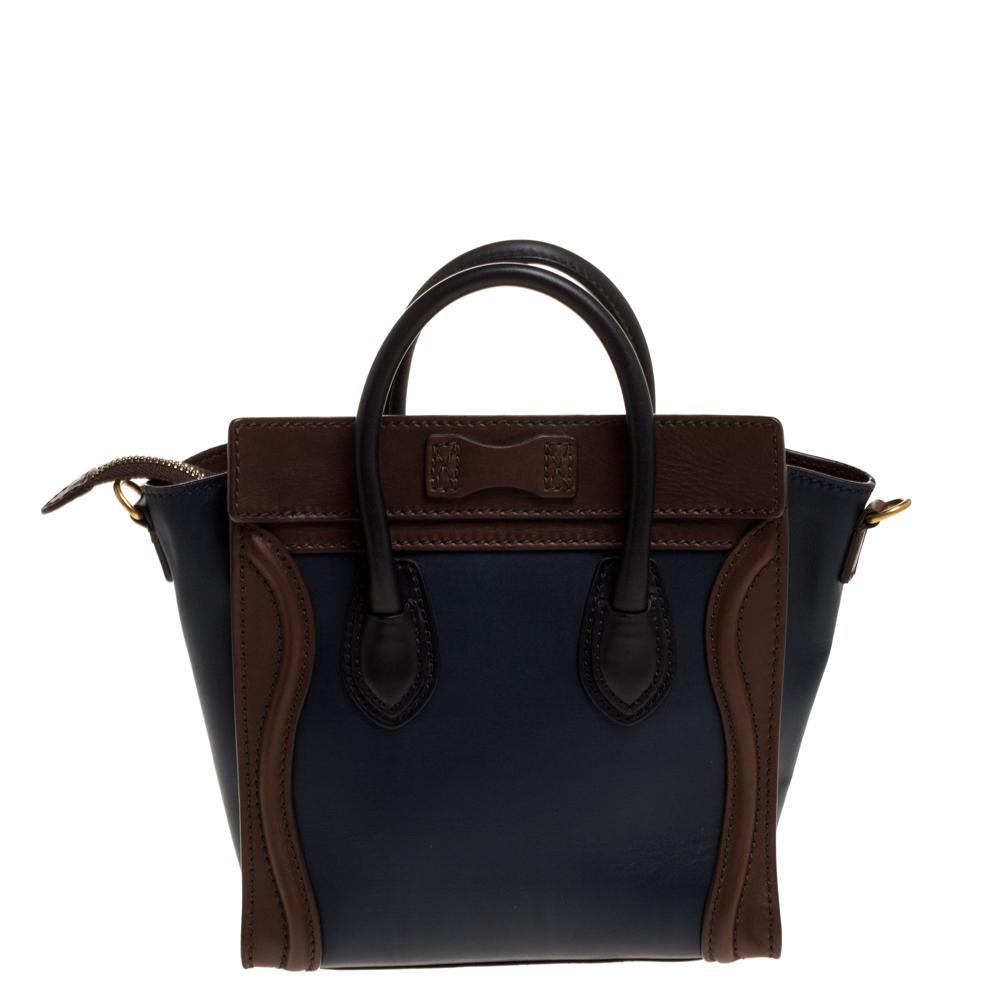 The Nano Luggage tote from Celine is one of the most popular handbags in the world. This tote is crafted from leather and designed in a navy blue shade. It comes with rolled top handles, a detachable shoulder strap and a front zip pocket. The bag is