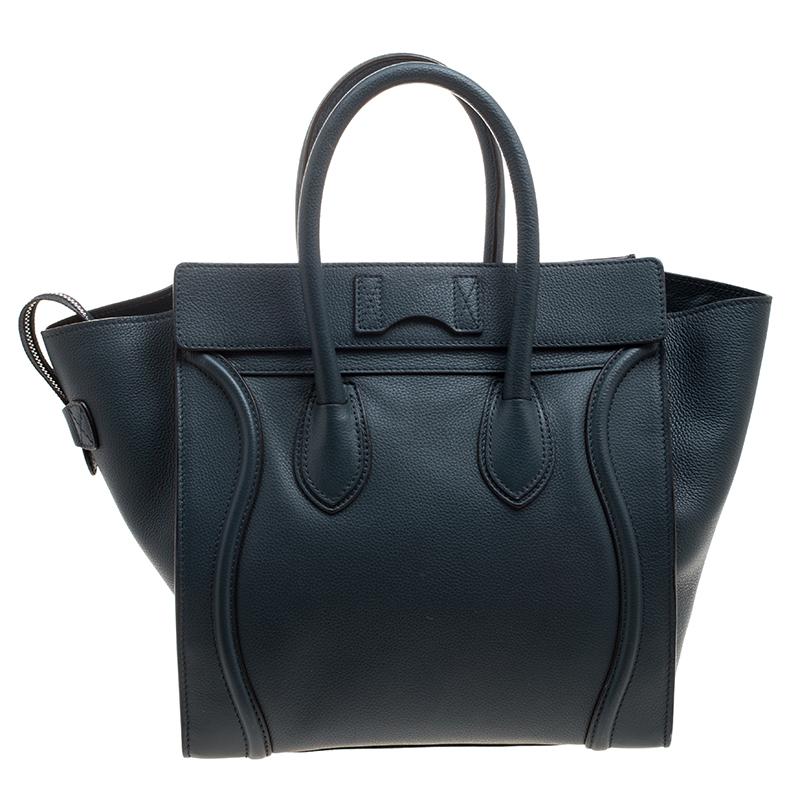 The Mini Luggage tote from Celine is one of the most popular handbags in the world. This tote is crafted from leather and it features a classy navy blue exterior with the signature flappy wings. It comes with rolled top handles, front zip pocket,
