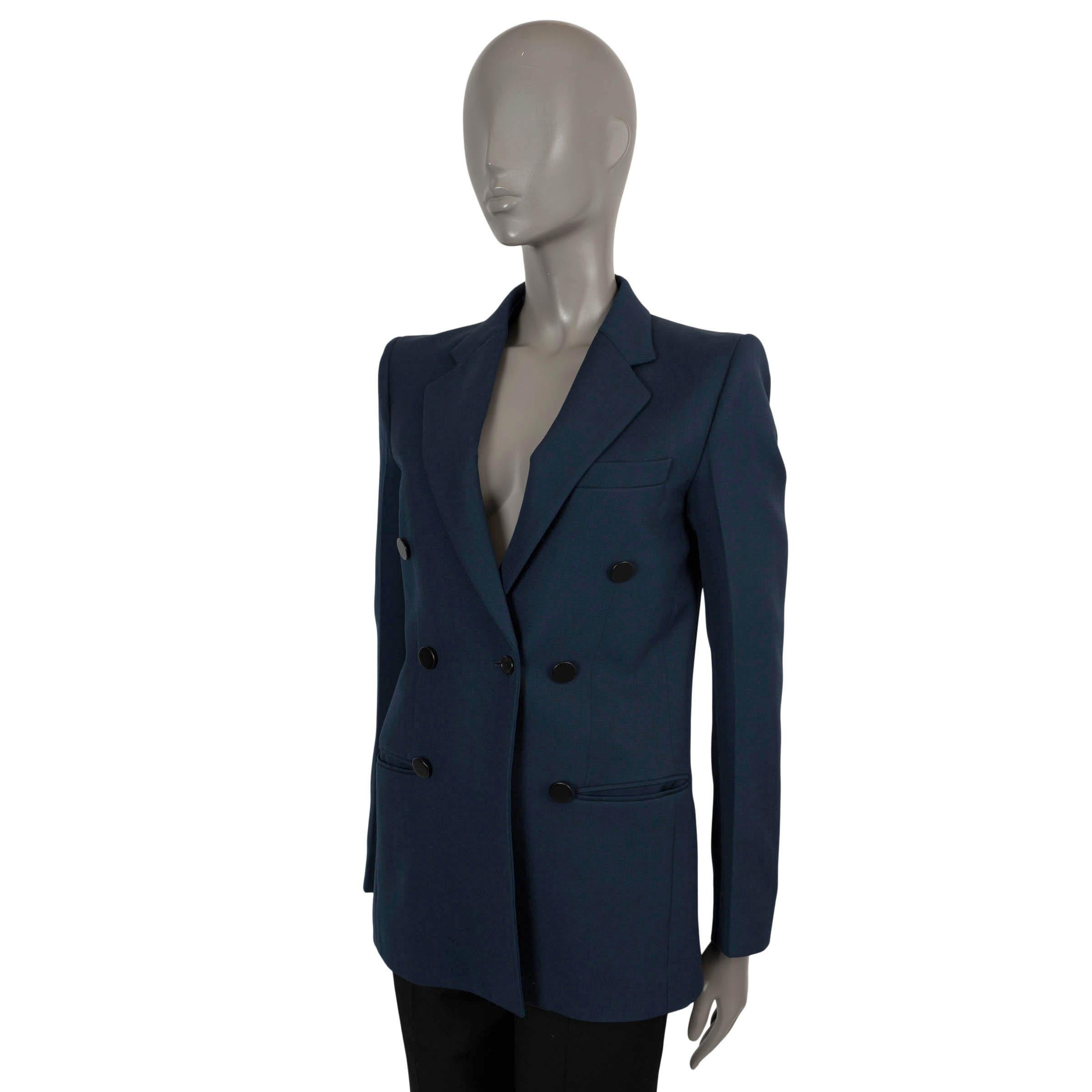 100% authentic Celine by Phoebe Philo faux double breasted blazer in navy blue wool (100%). Features notched lapels, two slit pockets at the waist and a chest pocket. Closes with a single black button and is lined in cupro (100%). Has been worn and