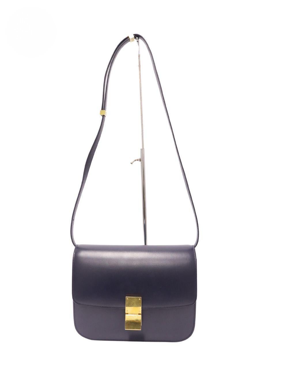 Celine Navy Leather Medium Classic Box Shoulder Bag, Features a leather adjustable strap, gold plaque, two compartments and one interior pocket.

Material: Leather
Hardware: Gold
Height: 18cm
Width: 23cm
Depth: 8cm
Strap Drop: 44cm
Overall