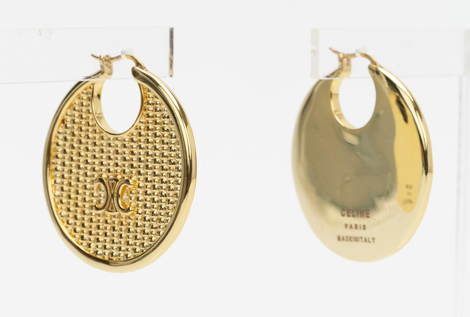 Celine new pierced hoops with gold plating and logo. Come with velvet pouch .