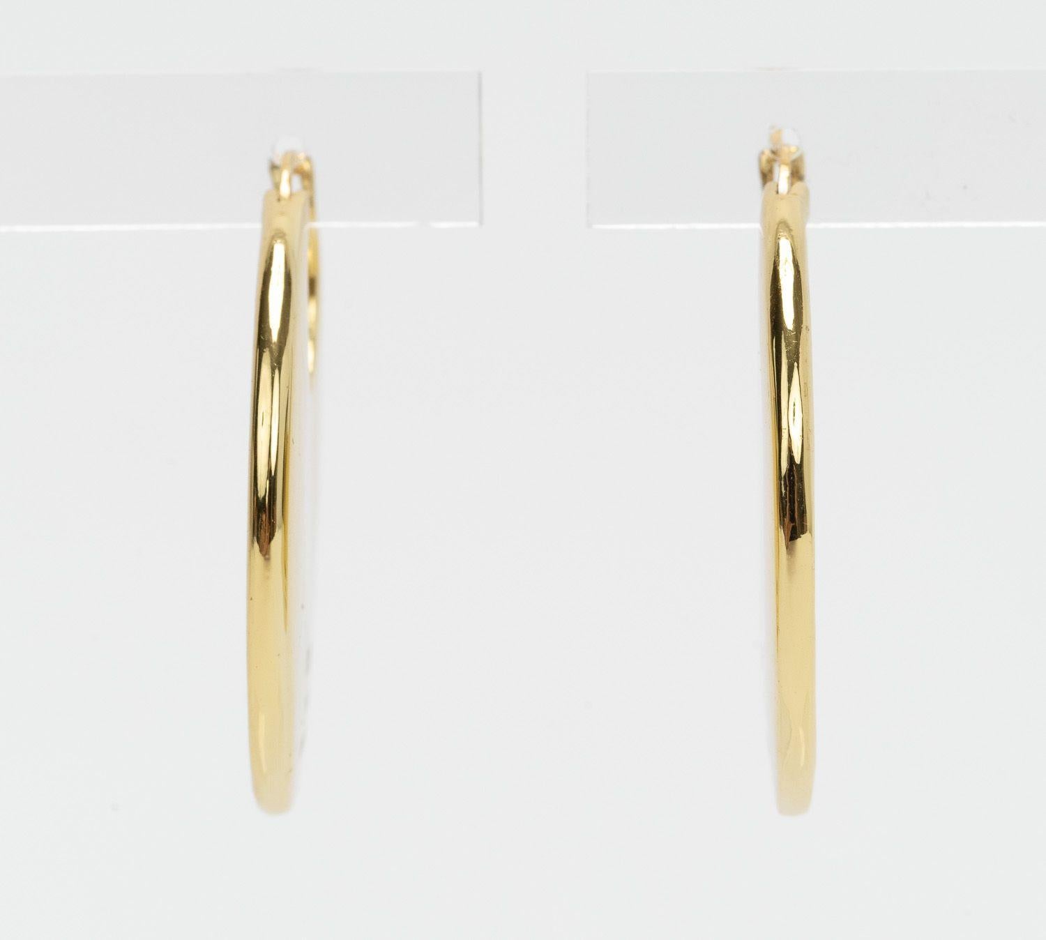 Celine New Logo Pierced Gold Hoops In New Condition For Sale In West Hollywood, CA