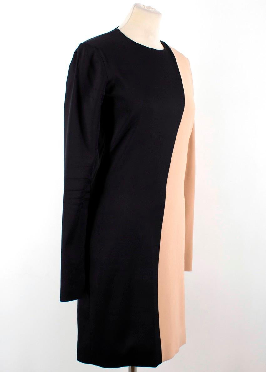 Celine Nude and Black Colour Block Mini Dress

-Nude and black colour block dress
-Minidress with long sleeves
-Zip closure
-Scoop neckline
-Zips on cuffs

Please note, these items are pre-owned and may show signs of being stored even when unworn