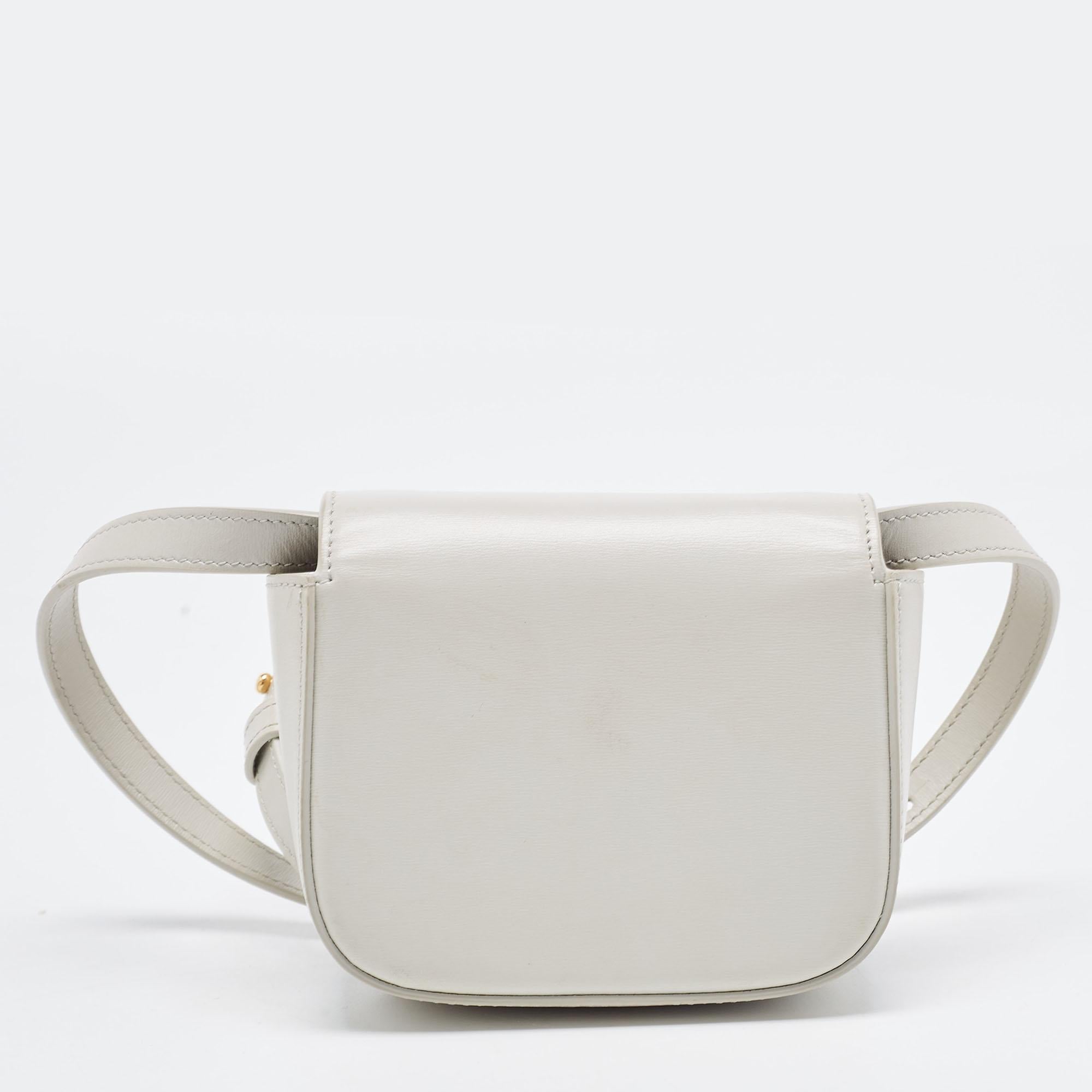 Marked by flawless craftsmanship and enduring appeal, this Celine Claude shoulder bag in off-white is bound to be a versatile and durable accessory. It has a well-sized interior and a shoulder strap.

Includes: Detachable strap