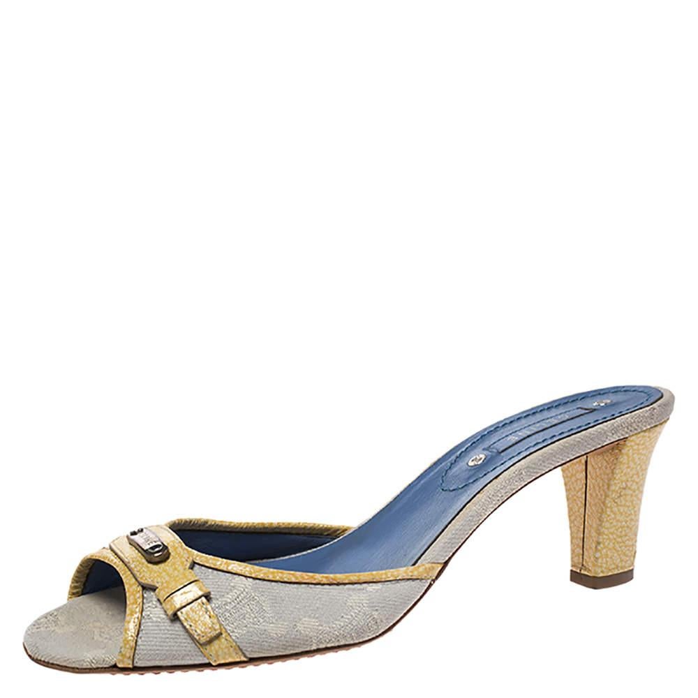 These fashionable sandals from Celine can give your entire ensemble a makeover. These macadam canvas sandals feature open toes, patent trims and 7 cm heels.  Wear these sandals and look chic no matter what occasion it is.