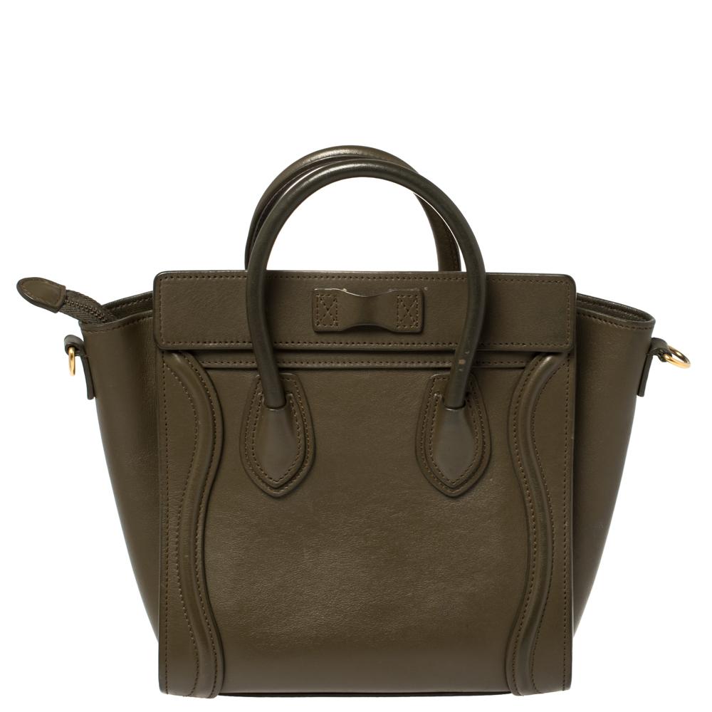The Nano-sized Luggage tote from Céline is one of the most popular handbags in the world. This tote is crafted from leather and designed in an olive green shade. It comes with rolled top handles, a detachable shoulder strap, and a front zip pocket.