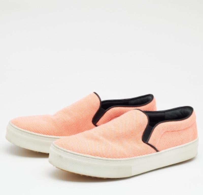 To accompany your attires with ease, Celine brings you this pair of sneakers that speak nothing but comfort. They've been crafted from orange canvas and made ready with round toes, leather insoles and rubber soles.