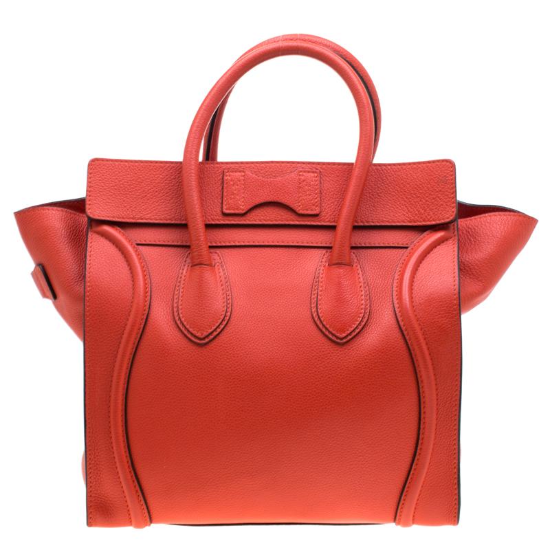 The mini Luggage tote from Celine is one of the most popular handbags in the world. This tote is crafted from leather and designed in an orange shade. It comes with rolled top handles and a front zip pocket. The bag is equipped with a well-sized