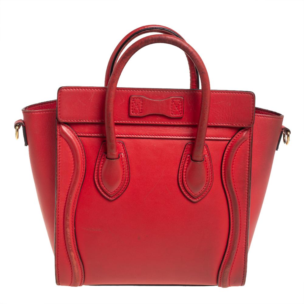 The Luggage tote from Celine is one of the most popular handbags in the world. This tote is crafted from leather and designed in an orange shade. It comes with rolled top handles, a detachable shoulder strap, and a front zip pocket. The bag is