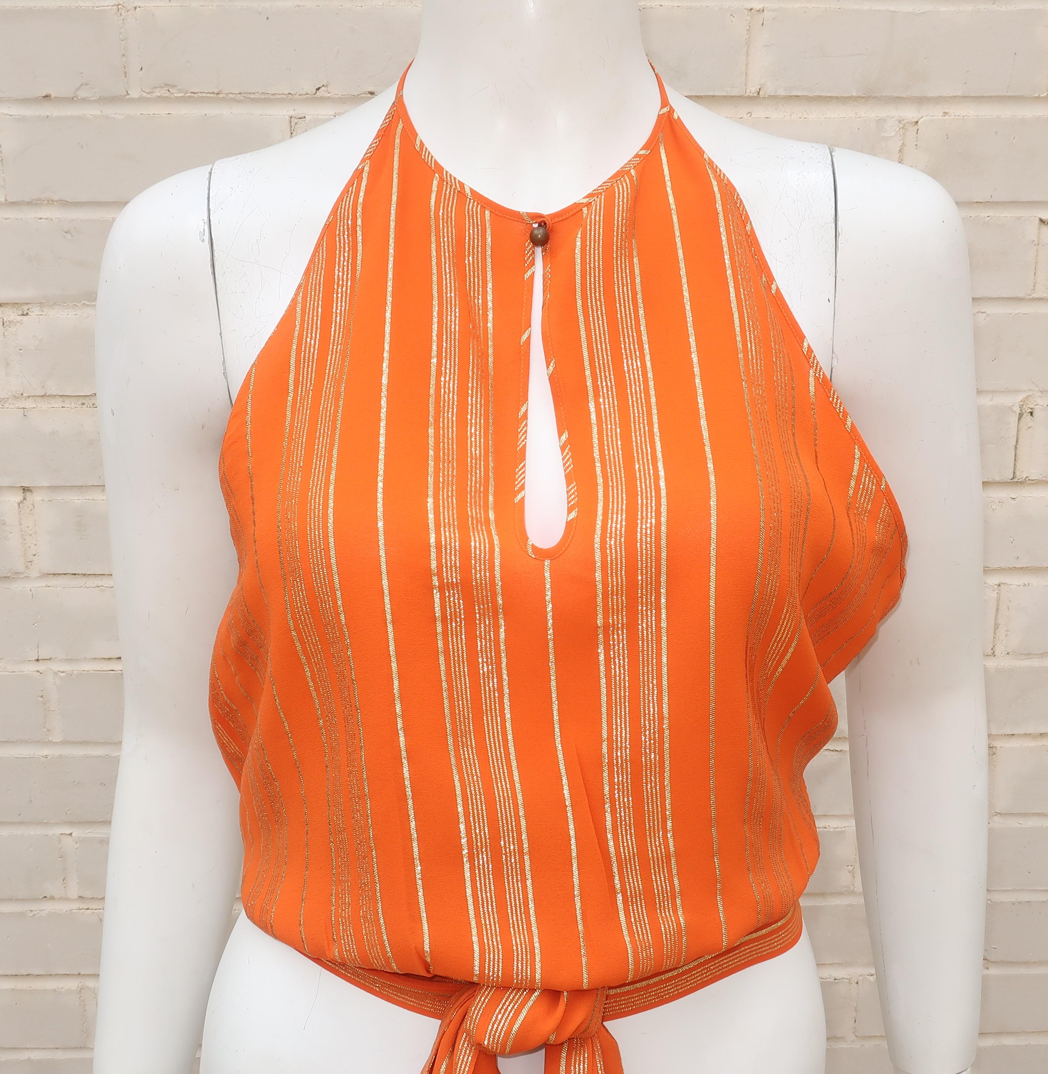 This Celine orange silk crepe top with a gold lamé stripe pattern is part tank and part halter.  It features a keyhole button neckline with spaghetti straps offering an open back for a stylish combination of casual and chic.  The cummerbund style