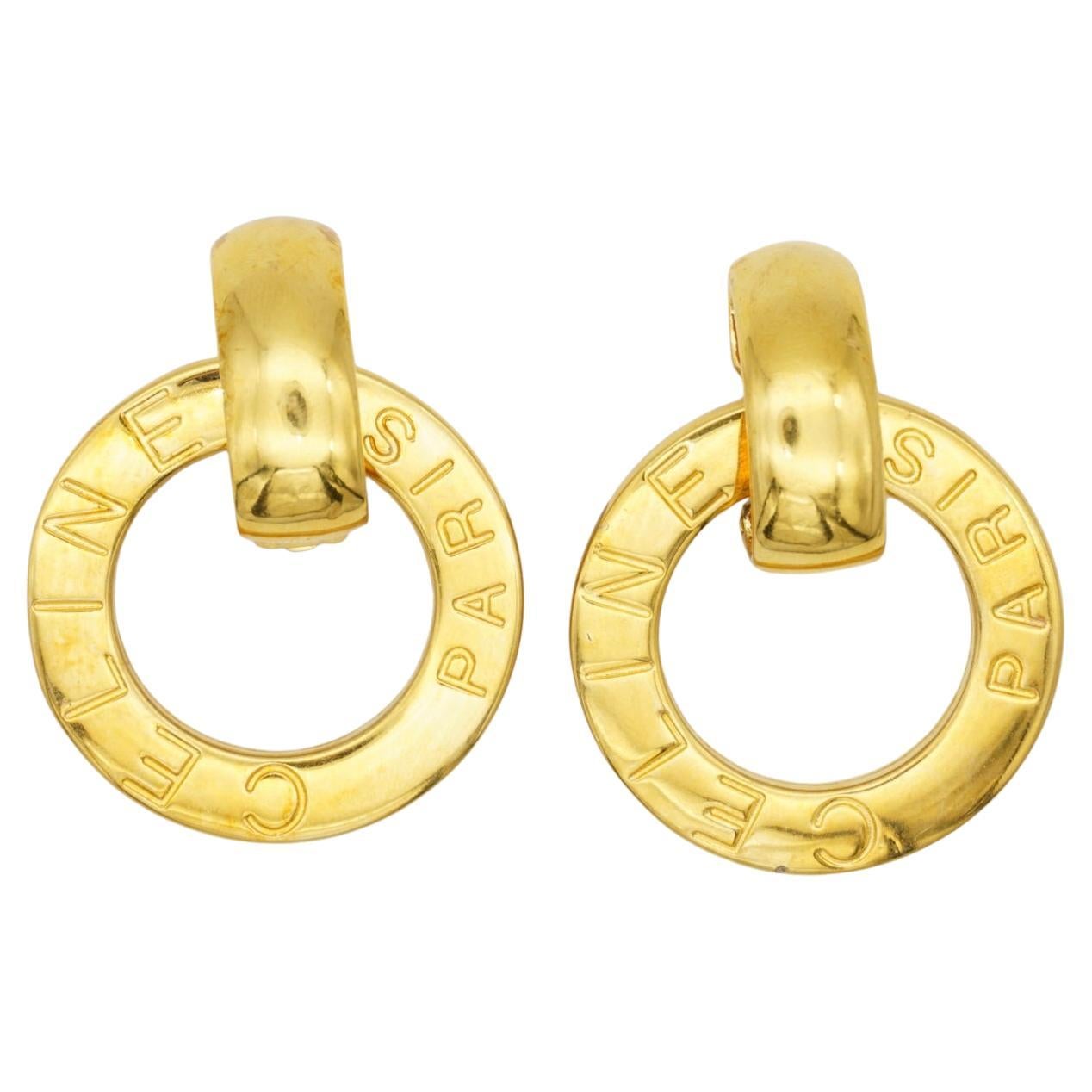 Celine Paris 1980s Vintage Unisex Massive Iconic Logo Monogram Circle Round Hoop Large Chunky Modernist Drop Clip Earrings, Gold Plated

Versatile earrings. Can be worn in different style.

Very good condition. 100% Genuine. Light scratches or