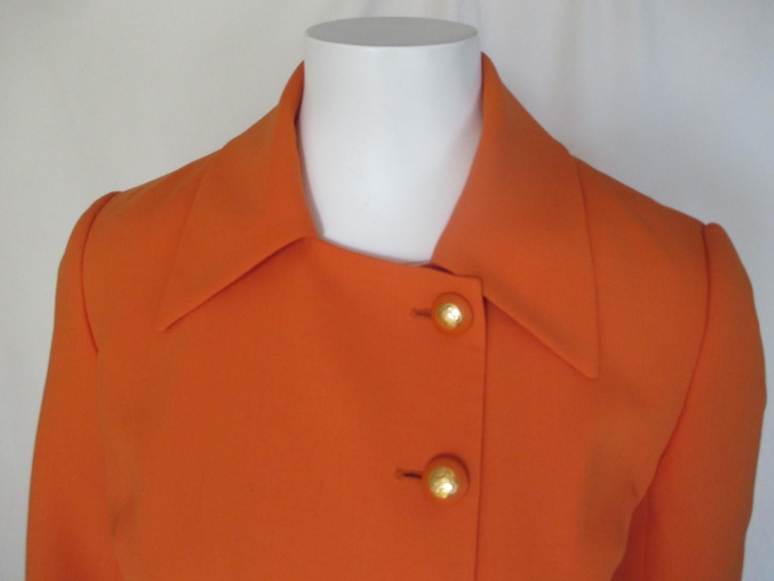 Orange vintage blazer from Celine Paris
with 2 pockets , 1 inside closing button and 6 gold tone Celine buttons.
Material: Light wool, Fully lined 
Appears to be small, please refer to the measurements in the description.

Pre-owned condition with