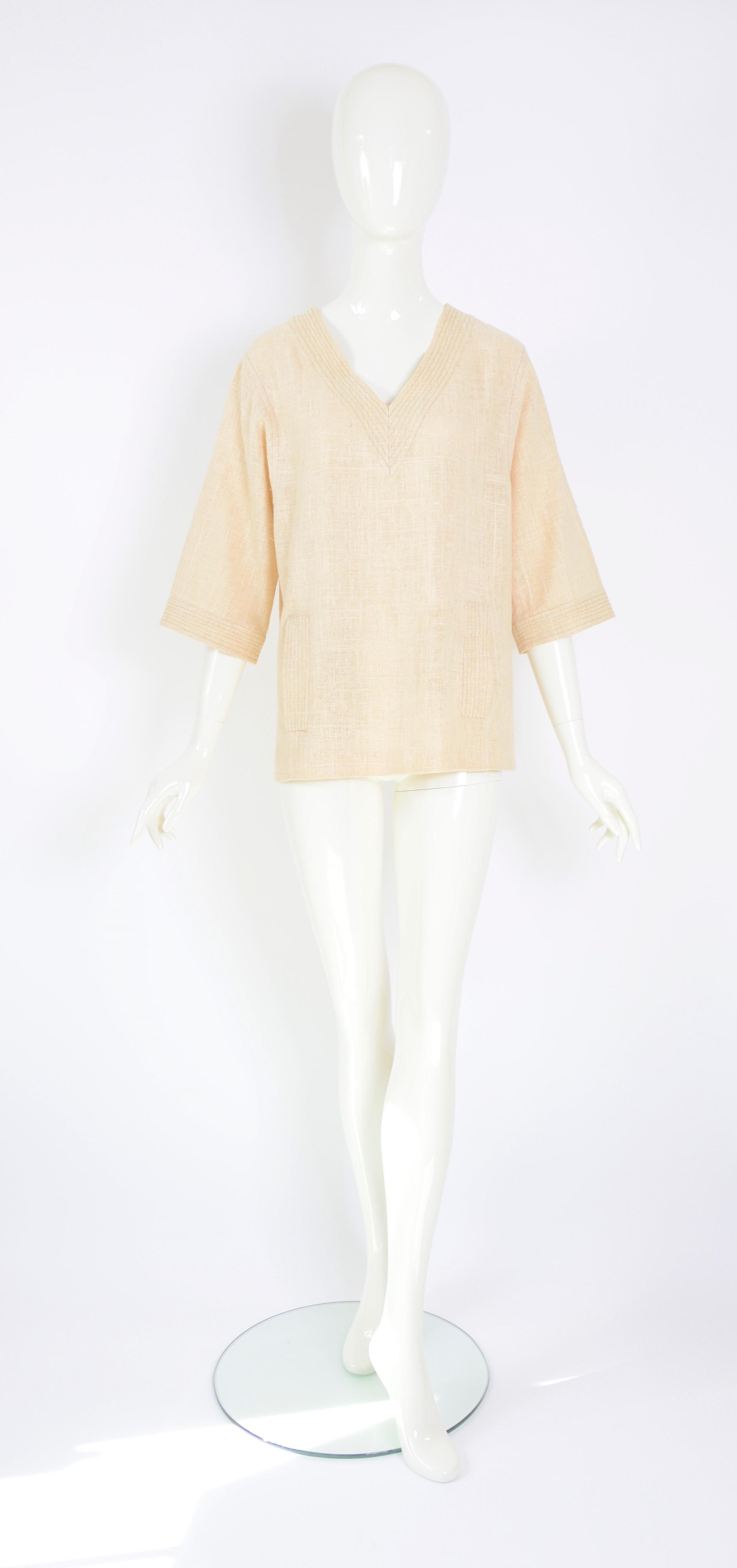 White Celine Paris vintage 1970s blouse made in linen or raw jute fabric.