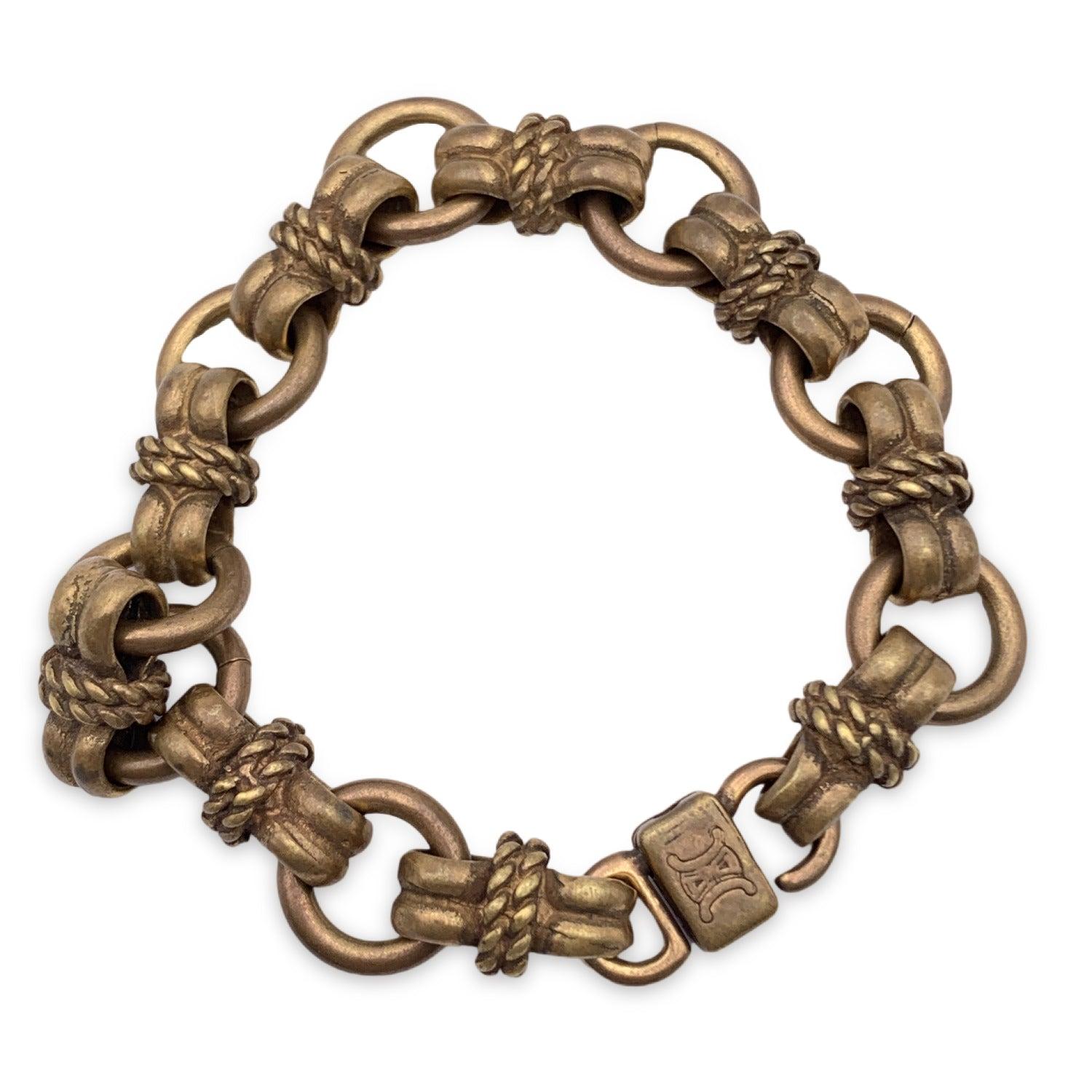 Beautiful vintage Celine bracelet in antiquated gold metal. Twist closure. 'Celine Paris' engraved on Internal circumference: 7.25 inches - 18 cm Condition A - EXCELLENT Gently used. Please check pictures carefully and ask for any detail requested.