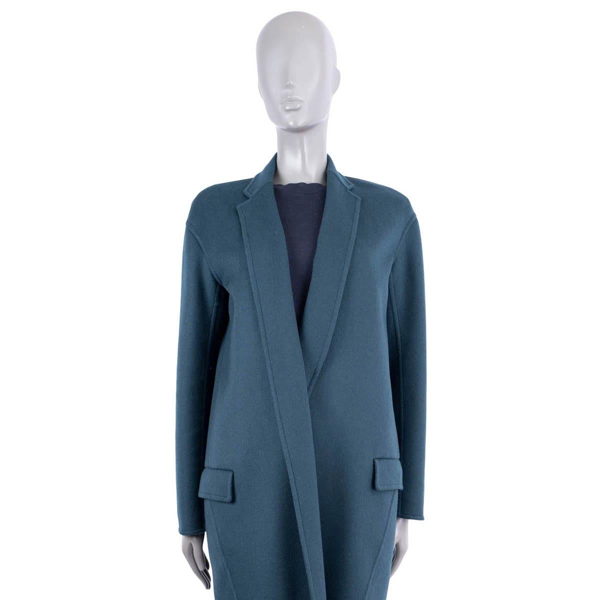 100% authentic Céline by Phoebe Philo cocoon coat in petrol cashmere (100%). Features a cocoon silhouette, two flap pockets on the front, drop shoulder and a slit on the back. Has been worn and is in excellent condition.

Measurements
Tag
