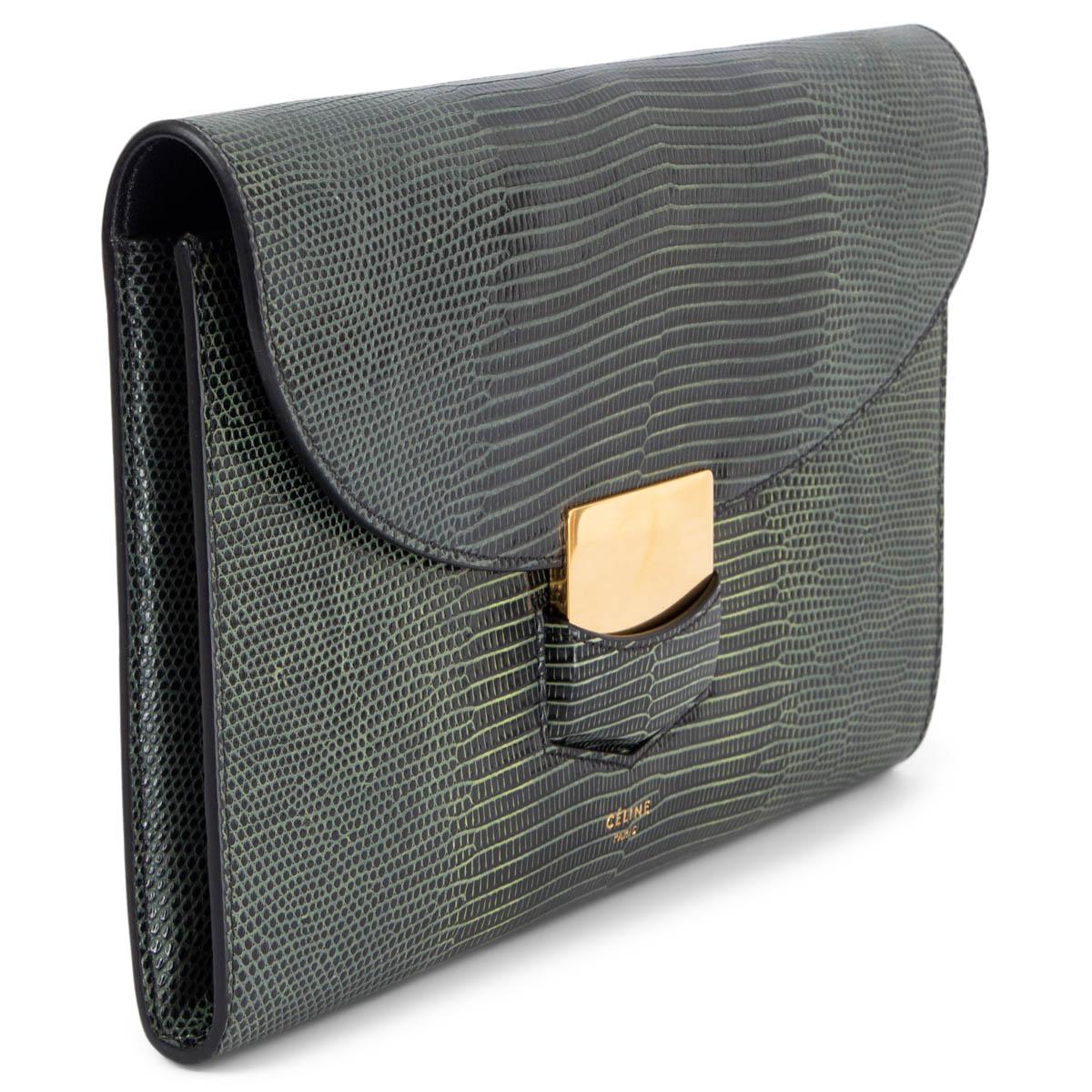 100% authentic Céline Trotteur flap clutch in pale petrol, olive green and black lizard featuring gold-tone metal clasp. Lined in black lambskin with three credit card slots against the back and an open pocket against the front. Has been carried and