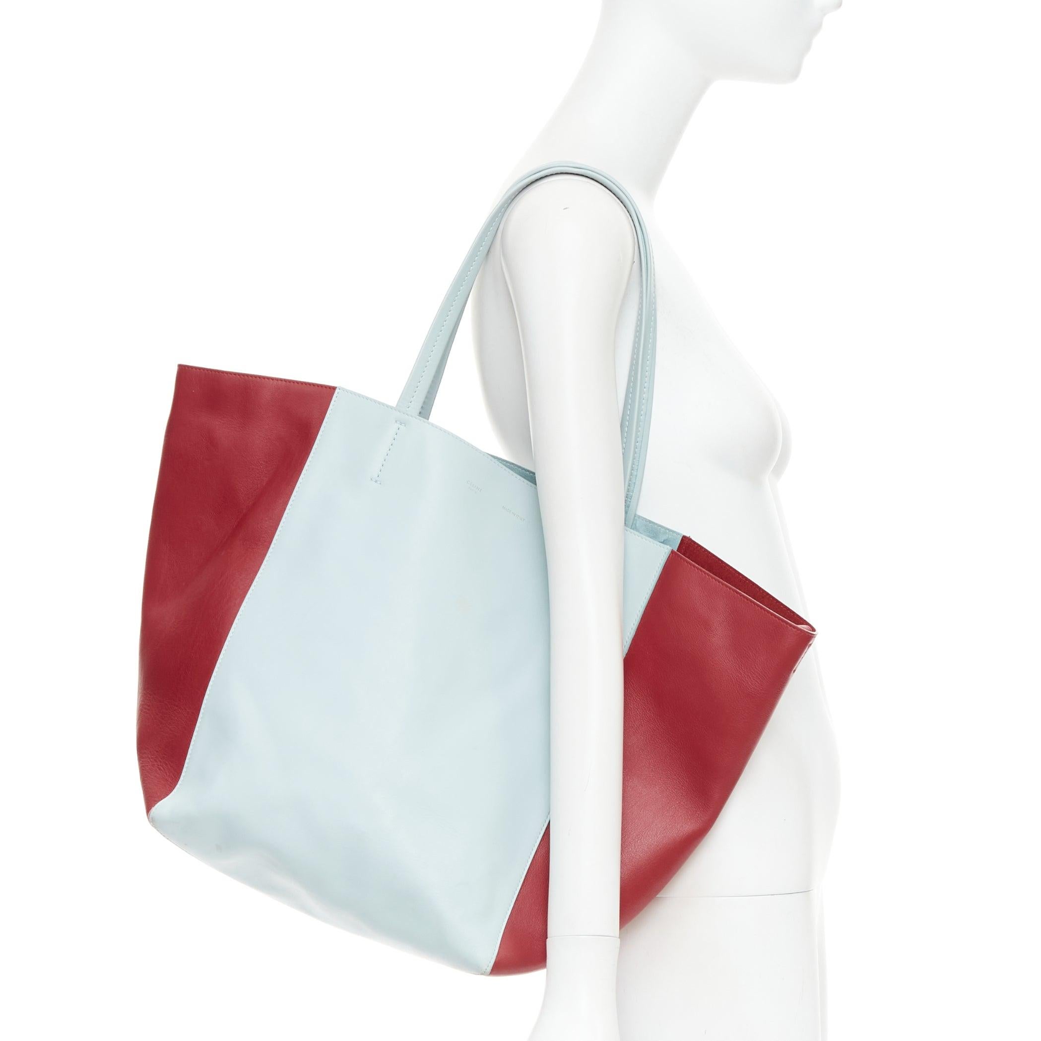 Bolso de mano CELINE Phantom Cabas azul bebé rojo bicolor horizontal
Referencia: CNPG/A00118
Marca: Celine
Diseñadora: Phoebe Philo
Model No: Cabas Phantom
Material: Piel
Color: Rojo, Azul
Patrón: Sólido
Cierre: Self Tie
Detalles adicionales: