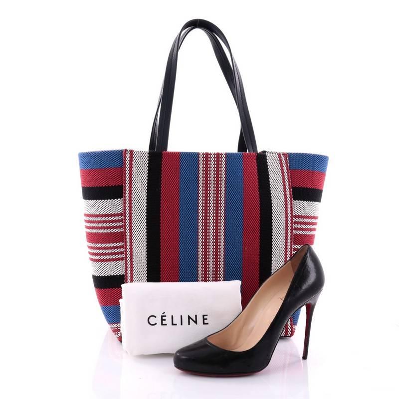 This authentic Celine Phantom Cabas Tote Woven Cotton Small is the perfect everyday shopper bag holding all essentials. Crafted in red, white, blue and black woven cotton, this tote features dual slim leather handles, and gold-tone hardware accents.