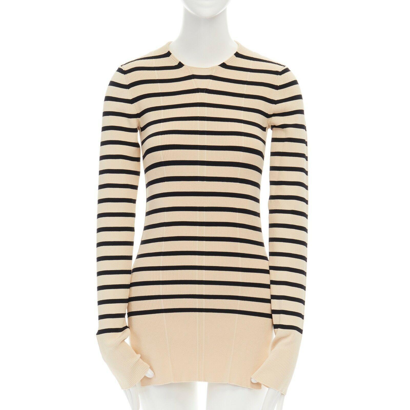 CELINE PHILO beige black nautical stripe side slit ribbed stretch sweater top S

CELINE by PHOEBE PHILO
Viscose, cotton, polyamide, elasthane. Beige and black nautical horizonal stripes. Round neck. Ribbed knt. Long fitted sleeves. Fitted body. Dual